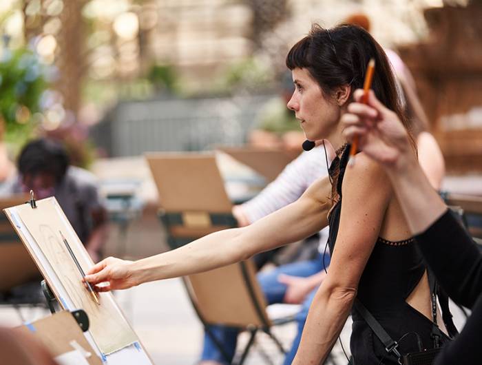Instructor leads painting workshop in Bryant Park