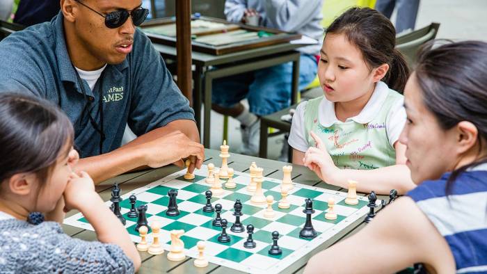 Park staff facilitates a game with kids in Bryant Park NYC.