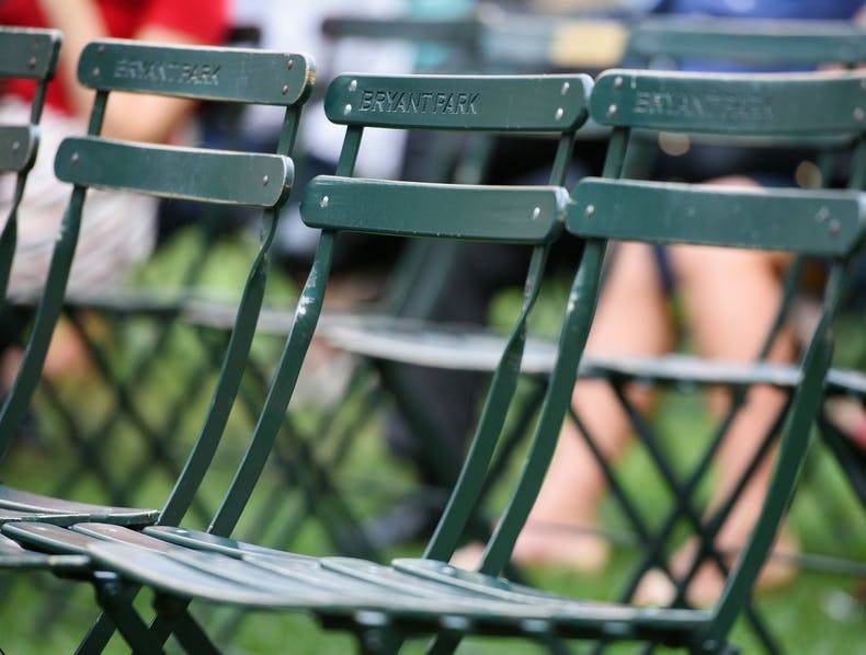 Iconic green bistro chairs of bryant park in new york city