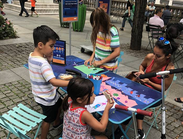 Children drawing at the Art Cart in Bryant Park.