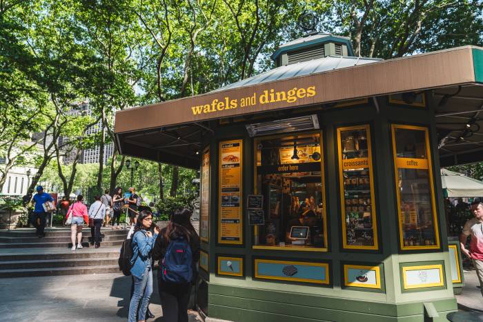 Customers stand at the Wafels & Dinges kiosk in Bryant Park.