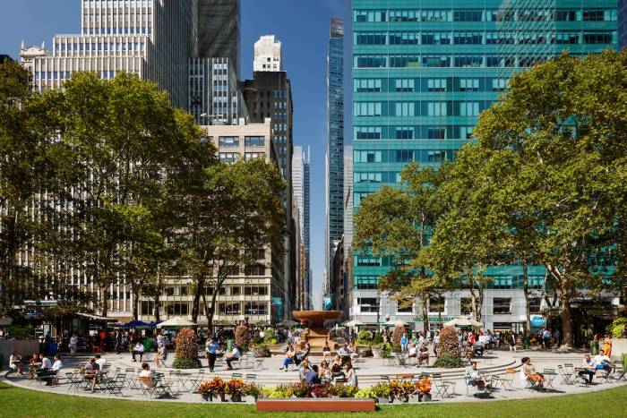 The Josephine Shaw Lowell memorial fountain in summer as viewed from the lawn at Bryant Park in New York City.
